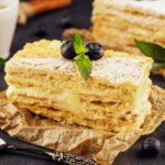 baked cake Napoleon, Millefeuille garnished with blueberry and mint