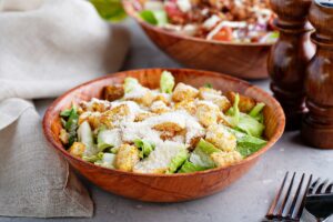 Caesar salad in a wooden bowl