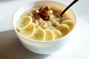Healthy breakfast with oatmeal, hazelnuts and banana