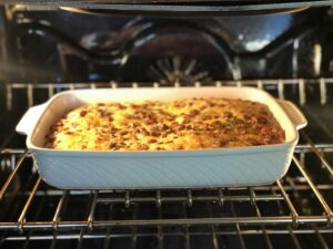 Making a breakfast casserole in the oven in preparation for holiday guests